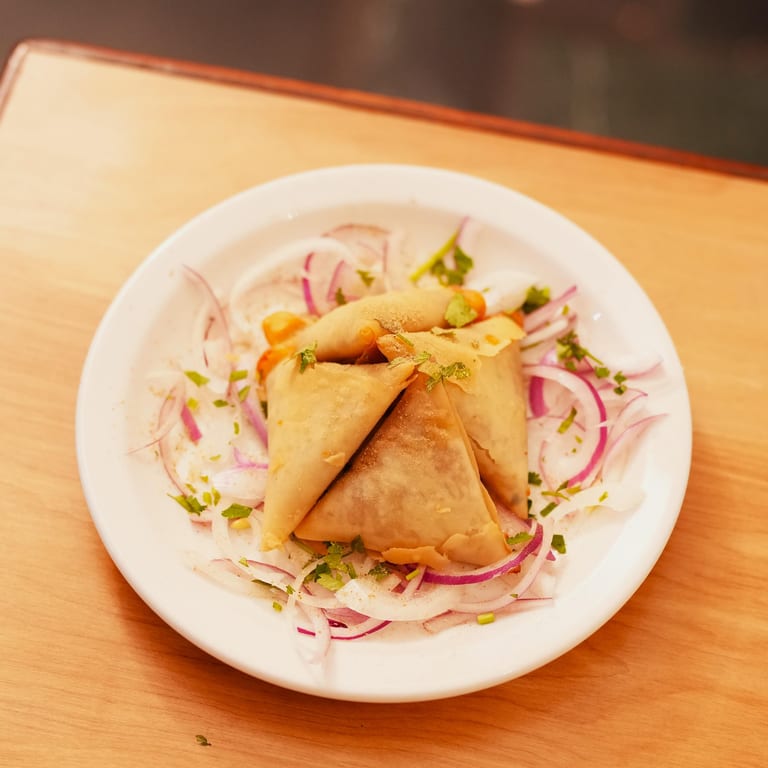 Savor Our Crispy Samosas